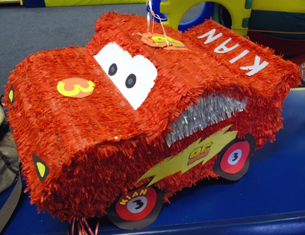 red car Piñata inspired by the Lightning McQueen car from Disney